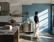 Blue paint transforms dated condo kitchen after 16 years