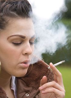 teenage girl smoking a pretend cannabis joint. Image shot 2008. Exact date unknown.