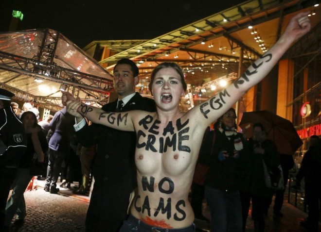 An activist from the women's rights organisation Femen protests before the screening of the movie Yi Dai Zong Shi, "The Grandmaster" at the 63rd Berlinale International Film Festival in Berlin