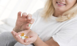 close up smiley woman holding ma 1 265x160