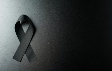 top view black bow as mourning symbol dark wall 1 364x230