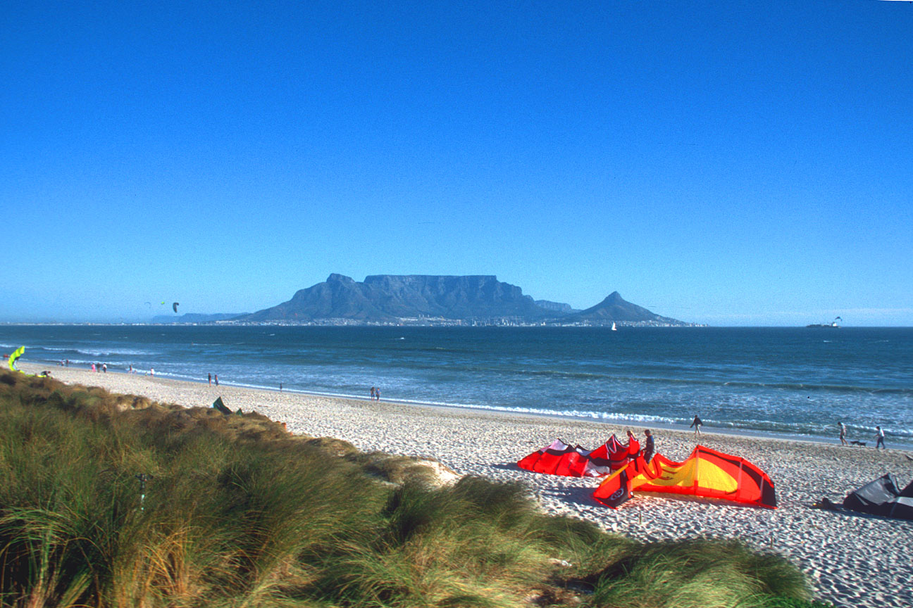 CPT Bloubergstrand beach with Table Mountain and kite surfers b