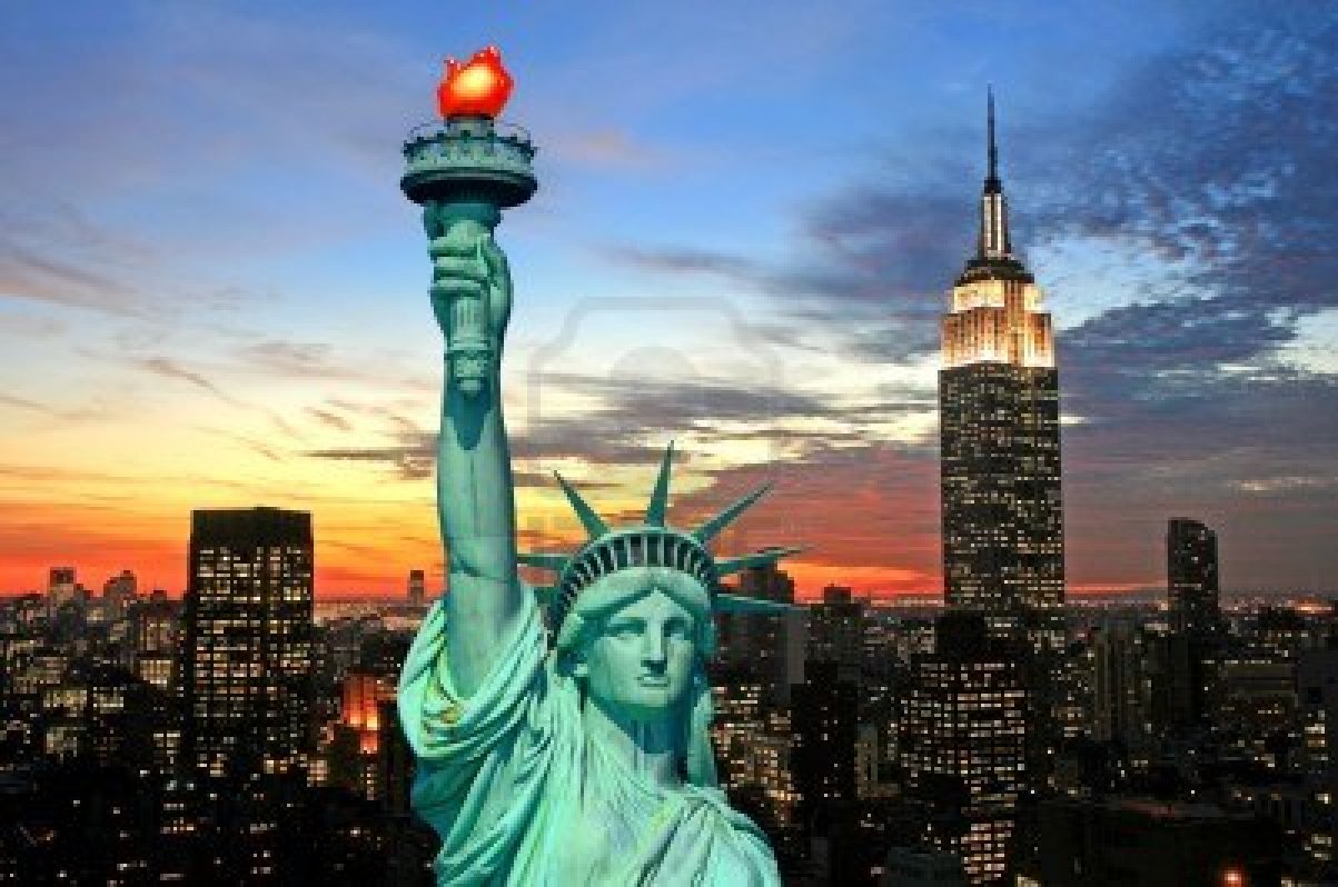 2268892 the statue of liberty and new york city skyline at dark